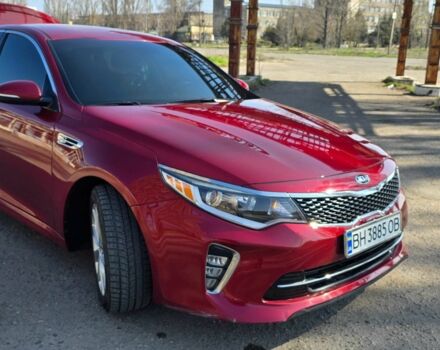 Красный Киа Оптима, объемом двигателя 2.4 л и пробегом 95 тыс. км за 13300 $, фото 1 на Automoto.ua