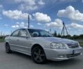 Серый Киа Оптима, объемом двигателя 2 л и пробегом 286 тыс. км за 3350 $, фото 2 на Automoto.ua