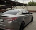 Сірий Кіа Оптіма, об'ємом двигуна 2 л та пробігом 256 тис. км за 8922 $, фото 2 на Automoto.ua