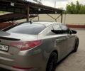 Сірий Кіа Оптіма, об'ємом двигуна 2 л та пробігом 251 тис. км за 10000 $, фото 5 на Automoto.ua