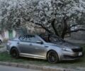 Серый Киа Оптима, объемом двигателя 2 л и пробегом 240 тыс. км за 9000 $, фото 1 на Automoto.ua