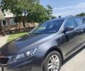 Серый Киа Оптима, объемом двигателя 2 л и пробегом 150 тыс. км за 10000 $, фото 1 на Automoto.ua