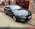 Серый Киа Оптима, объемом двигателя 2 л и пробегом 211 тыс. км за 10000 $, фото 1 на Automoto.ua