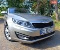 Серый Киа Оптима, объемом двигателя 2 л и пробегом 105 тыс. км за 10650 $, фото 1 на Automoto.ua