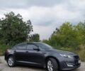 Сірий Кіа Оптіма, об'ємом двигуна 1.69 л та пробігом 180 тис. км за 11000 $, фото 1 на Automoto.ua