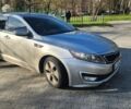 Сірий Кіа Оптіма, об'ємом двигуна 2.36 л та пробігом 255 тис. км за 9900 $, фото 1 на Automoto.ua