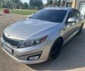 Серый Киа Оптима, объемом двигателя 2 л и пробегом 209 тыс. км за 10000 $, фото 1 на Automoto.ua