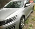 Серый Киа Оптима, объемом двигателя 2 л и пробегом 153 тыс. км за 10599 $, фото 1 на Automoto.ua