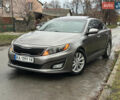 Сірий Кіа Оптіма, об'ємом двигуна 2.36 л та пробігом 220 тис. км за 8500 $, фото 1 на Automoto.ua