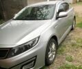 Серый Киа Оптима, объемом двигателя 2 л и пробегом 153 тыс. км за 10399 $, фото 1 на Automoto.ua