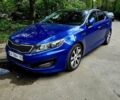 Синий Киа Оптима, объемом двигателя 2 л и пробегом 299 тыс. км за 10000 $, фото 1 на Automoto.ua