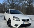 Белый Киа Рио, объемом двигателя 1.4 л и пробегом 150 тыс. км за 4900 $, фото 1 на Automoto.ua