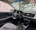 Білий Кіа Ріо, об'ємом двигуна 1.25 л та пробігом 69 тис. км за 9900 $, фото 10 на Automoto.ua