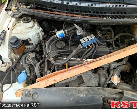 Білий Кіа Ріо, об'ємом двигуна 1.4 л та пробігом 289 тис. км за 3400 $, фото 3 на Automoto.ua