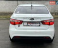 Белый Киа Рио, объемом двигателя 1.4 л и пробегом 246 тыс. км за 6550 $, фото 4 на Automoto.ua