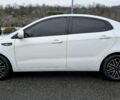 Білий Кіа Ріо, об'ємом двигуна 1.4 л та пробігом 124 тис. км за 7199 $, фото 1 на Automoto.ua