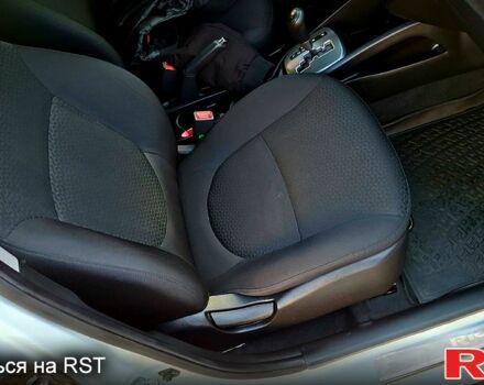 Білий Кіа Ріо, об'ємом двигуна 1.4 л та пробігом 87 тис. км за 8750 $, фото 9 на Automoto.ua