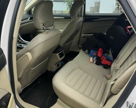 Білий Кіа Ріо, об'ємом двигуна 1.6 л та пробігом 144 тис. км за 12999 $, фото 8 на Automoto.ua