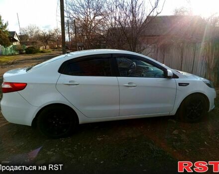 Білий Кіа Ріо, об'ємом двигуна 1.4 л та пробігом 870 тис. км за 7500 $, фото 1 на Automoto.ua