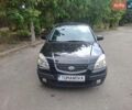 Чорний Кіа Ріо, об'ємом двигуна 1.6 л та пробігом 228 тис. км за 5500 $, фото 1 на Automoto.ua