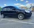 Черный Киа Рио, объемом двигателя 1.4 л и пробегом 185 тыс. км за 4300 $, фото 2 на Automoto.ua