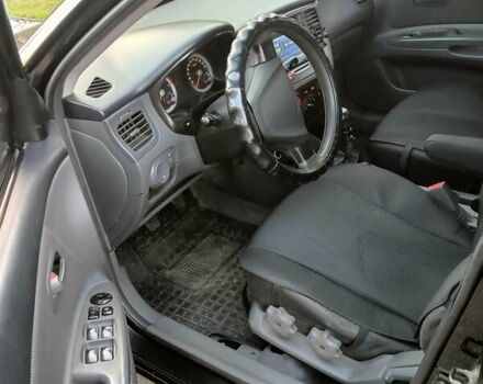 Черный Киа Рио, объемом двигателя 1.4 л и пробегом 297 тыс. км за 4500 $, фото 5 на Automoto.ua