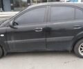 Чорний Кіа Ріо, об'ємом двигуна 1.4 л та пробігом 132 тис. км за 4000 $, фото 1 на Automoto.ua