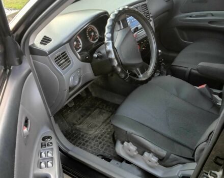 Черный Киа Рио, объемом двигателя 1.4 л и пробегом 297 тыс. км за 4500 $, фото 5 на Automoto.ua