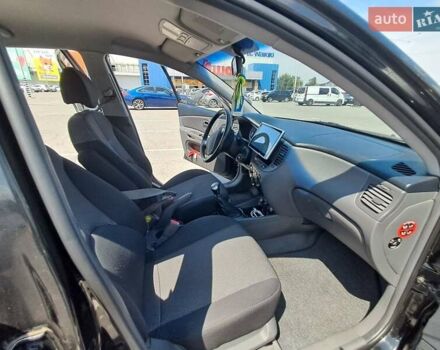 Черный Киа Рио, объемом двигателя 1.6 л и пробегом 164 тыс. км за 5400 $, фото 4 на Automoto.ua