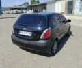 Черный Киа Рио, объемом двигателя 1.34 л и пробегом 201 тыс. км за 5400 $, фото 1 на Automoto.ua