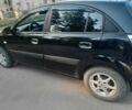Черный Киа Рио, объемом двигателя 1.4 л и пробегом 200 тыс. км за 4539 $, фото 1 на Automoto.ua