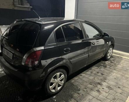 Чорний Кіа Ріо, об'ємом двигуна 1.4 л та пробігом 152 тис. км за 4500 $, фото 3 на Automoto.ua