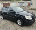 Черный Киа Рио, объемом двигателя 1.4 л и пробегом 110 тыс. км за 6156 $, фото 1 на Automoto.ua