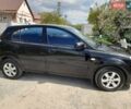 Черный Киа Рио, объемом двигателя 1.4 л и пробегом 220 тыс. км за 4500 $, фото 2 на Automoto.ua