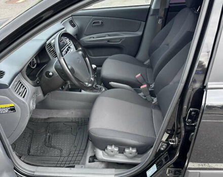 Черный Киа Рио, объемом двигателя 1.4 л и пробегом 158 тыс. км за 5000 $, фото 24 на Automoto.ua