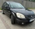 Черный Киа Рио, объемом двигателя 1.4 л и пробегом 230 тыс. км за 4400 $, фото 1 на Automoto.ua