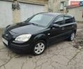 Черный Киа Рио, объемом двигателя 1.4 л и пробегом 110 тыс. км за 6100 $, фото 1 на Automoto.ua