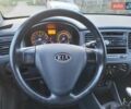 Чорний Кіа Ріо, об'ємом двигуна 1.4 л та пробігом 184 тис. км за 4800 $, фото 6 на Automoto.ua