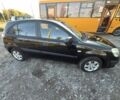 Черный Киа Рио, объемом двигателя 1.4 л и пробегом 174 тыс. км за 5514 $, фото 1 на Automoto.ua