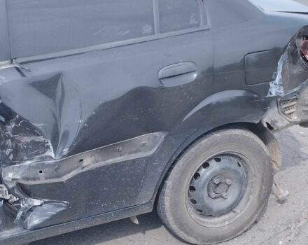 Черный Киа Рио, объемом двигателя 1.4 л и пробегом 100 тыс. км за 2000 $, фото 2 на Automoto.ua