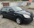 Черный Киа Рио, объемом двигателя 1.4 л и пробегом 110 тыс. км за 6100 $, фото 2 на Automoto.ua