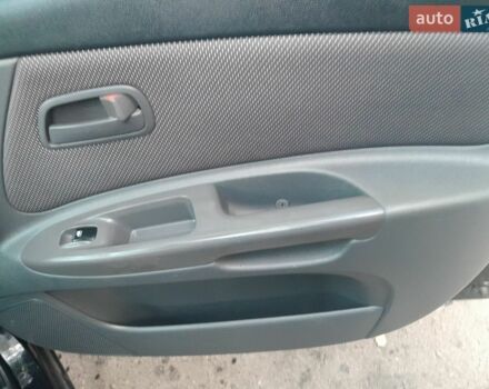 Чорний Кіа Ріо, об'ємом двигуна 1.4 л та пробігом 200 тис. км за 4500 $, фото 11 на Automoto.ua