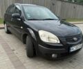 Черный Киа Рио, объемом двигателя 1.4 л и пробегом 230 тыс. км за 4400 $, фото 1 на Automoto.ua