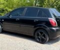 Чорний Кіа Ріо, об'ємом двигуна 1.4 л та пробігом 240 тис. км за 2750 $, фото 10 на Automoto.ua