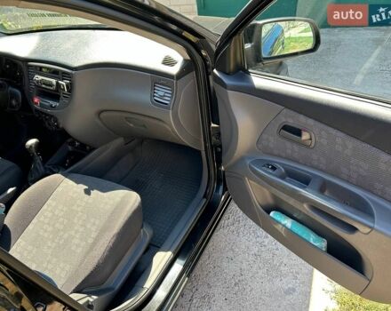 Черный Киа Рио, объемом двигателя 1.4 л и пробегом 214 тыс. км за 5100 $, фото 9 на Automoto.ua