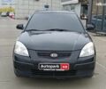 Черный Киа Рио, объемом двигателя 1.4 л и пробегом 274 тыс. км за 5290 $, фото 1 на Automoto.ua