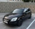 Черный Киа Рио, объемом двигателя 1.4 л и пробегом 230 тыс. км за 3850 $, фото 1 на Automoto.ua