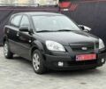 Черный Киа Рио, объемом двигателя 1.4 л и пробегом 166 тыс. км за 5999 $, фото 1 на Automoto.ua