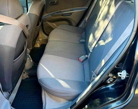 Черный Киа Рио, объемом двигателя 1.4 л и пробегом 260 тыс. км за 3900 $, фото 5 на Automoto.ua