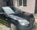 Черный Киа Рио, объемом двигателя 1.4 л и пробегом 260 тыс. км за 3600 $, фото 1 на Automoto.ua